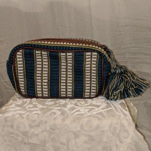 Greek, teal, yellow, white, and brown bag